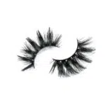 A pair of fluffy, black false eyelashes on a white background.
